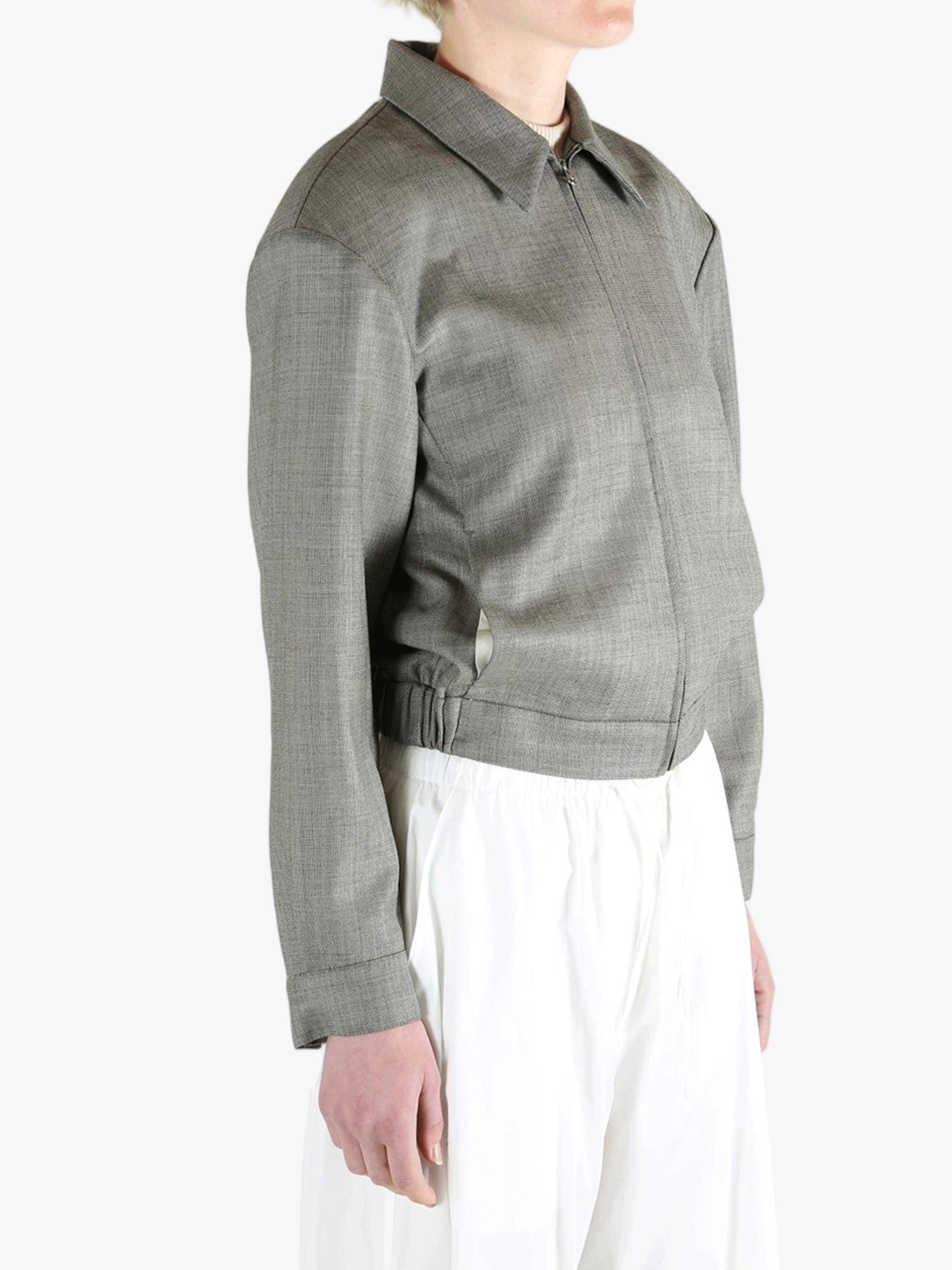 Grey jacket worn by a person, showing the jacket fit