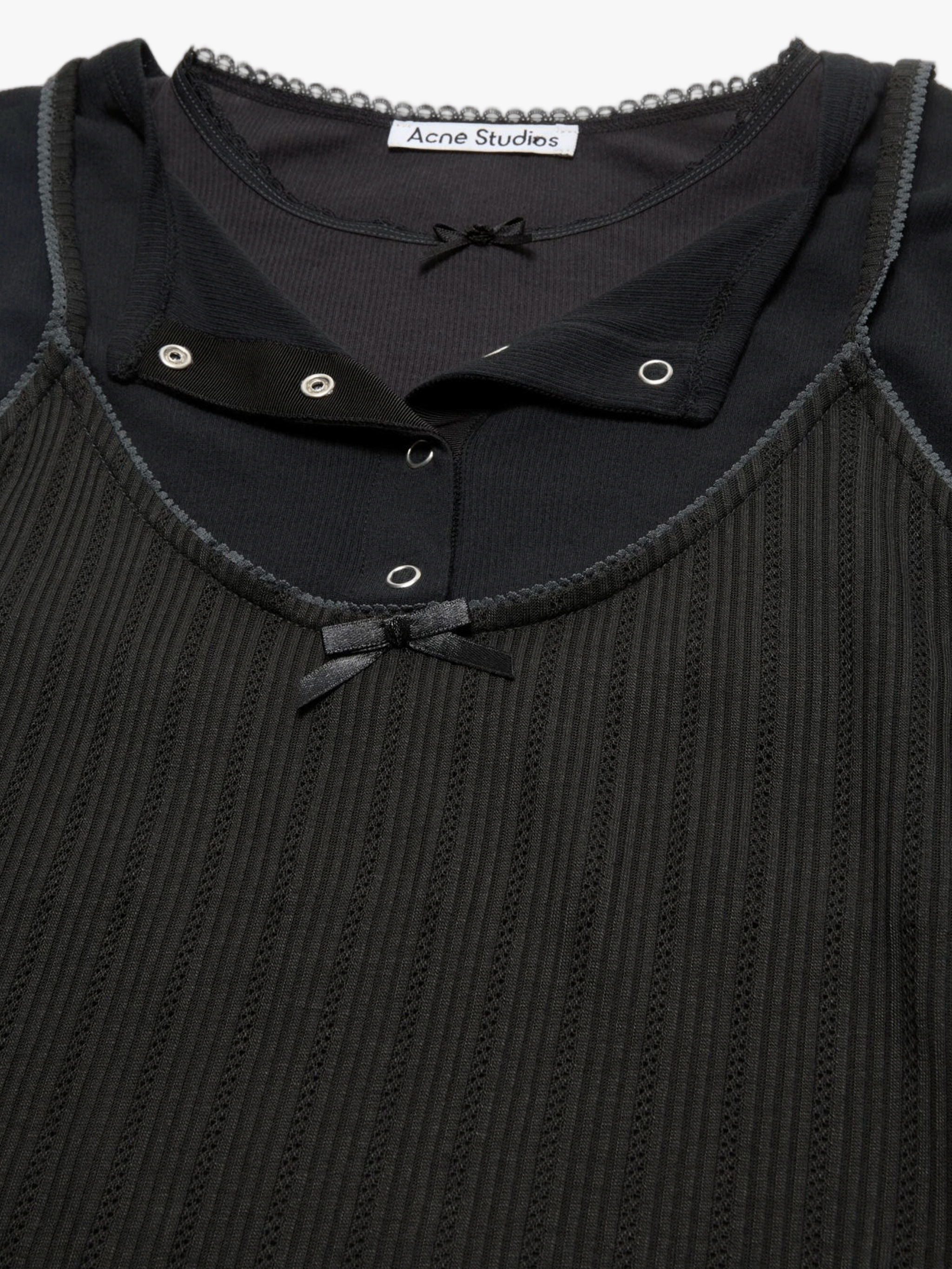Close up of Black t-shirt, showing texture of the 100% cotton fabric