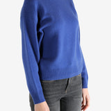 blue sweater worn by a person, showing the sweater fit