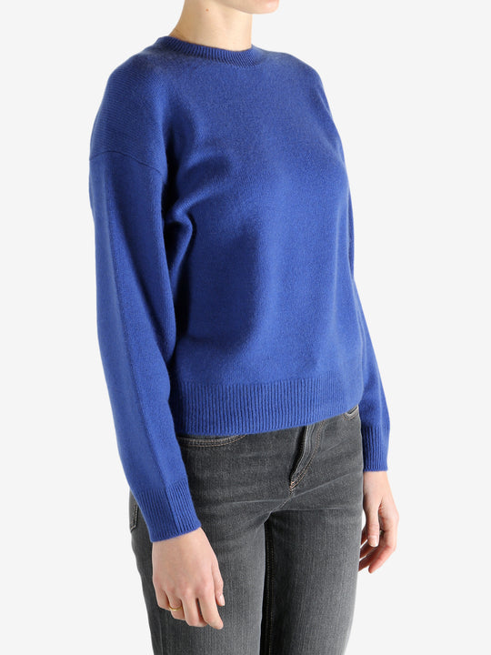 blue sweater worn by a person, showing the sweater fit