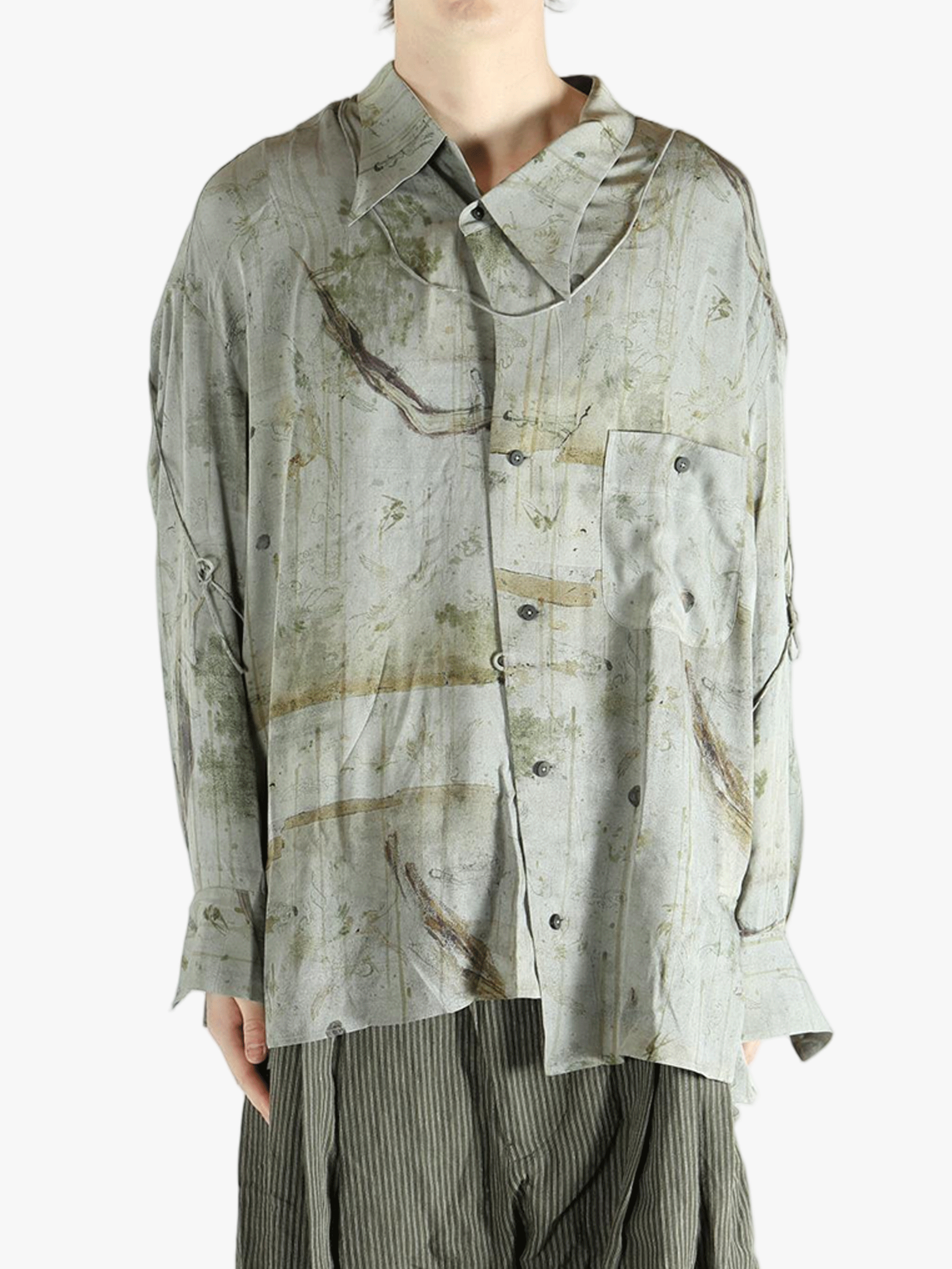 Green shirt worn by a person, showing the shirt's fit