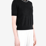 Black t-shirt worn by a person, showing the t-shirt fit