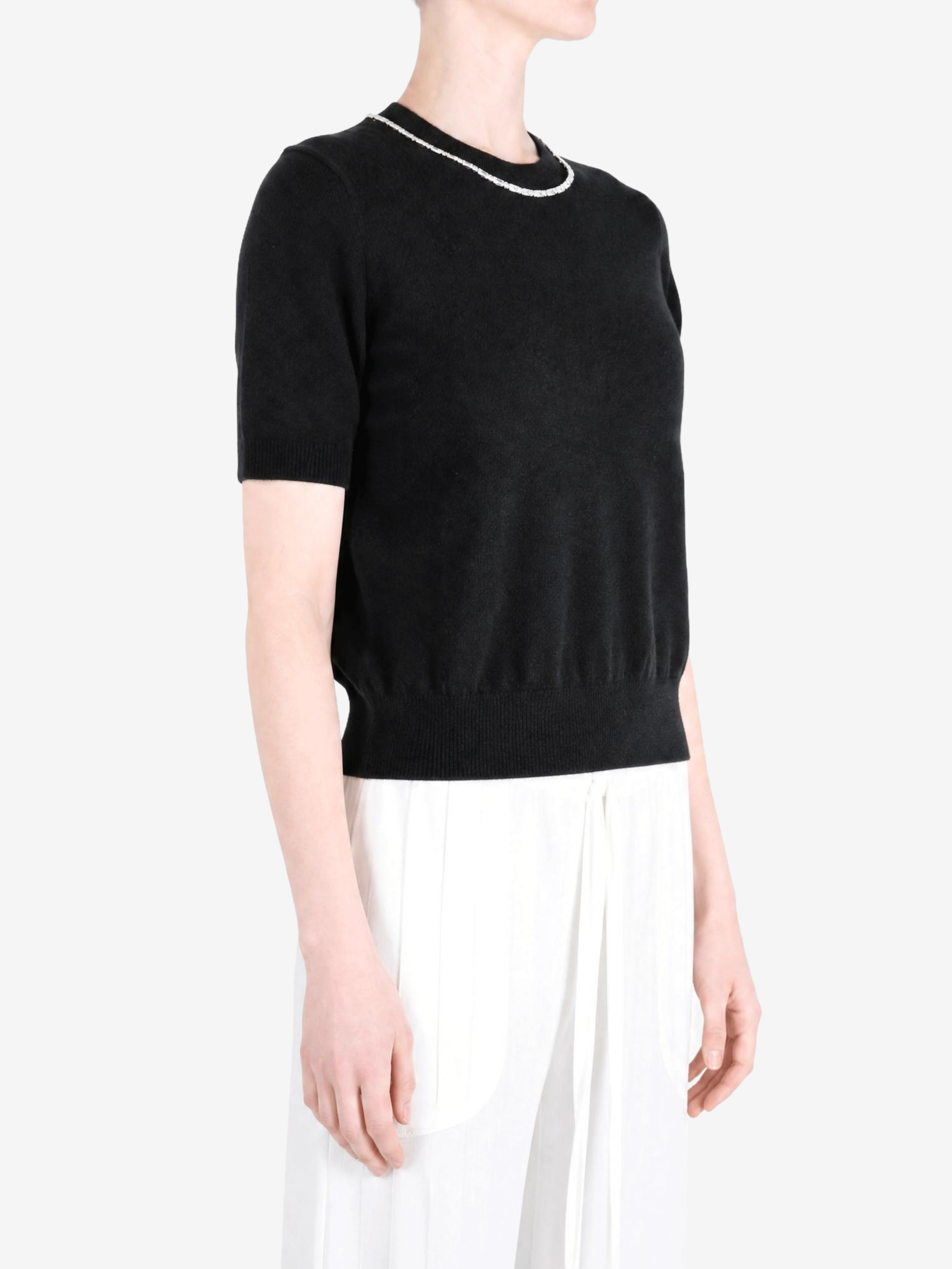 Black t-shirt worn by a person, showing the t-shirt fit