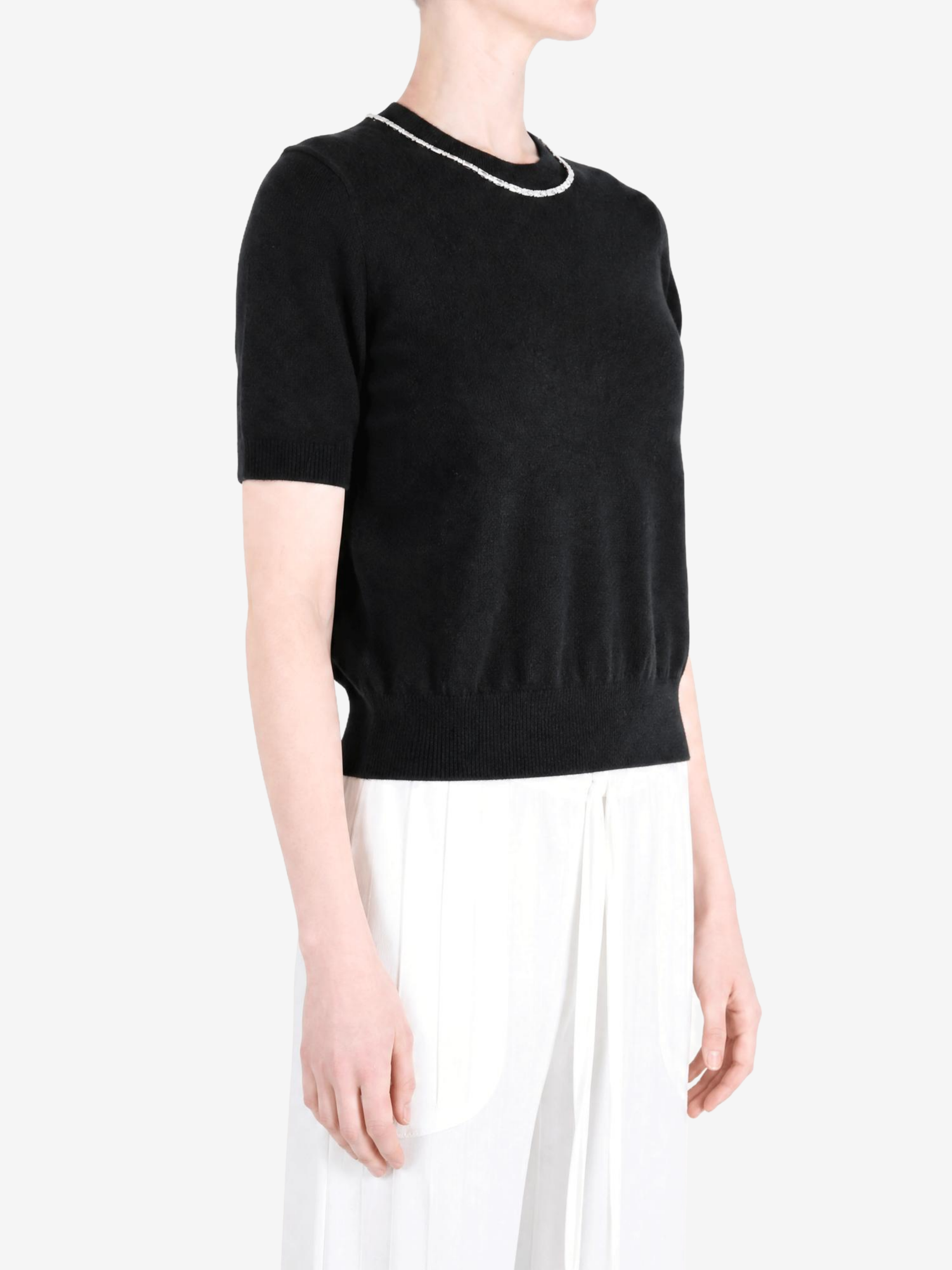 Black t-shirt worn by a person, showing the t-shirt fit