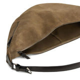 Close up of the brown bag, showing texture of the leather fabric