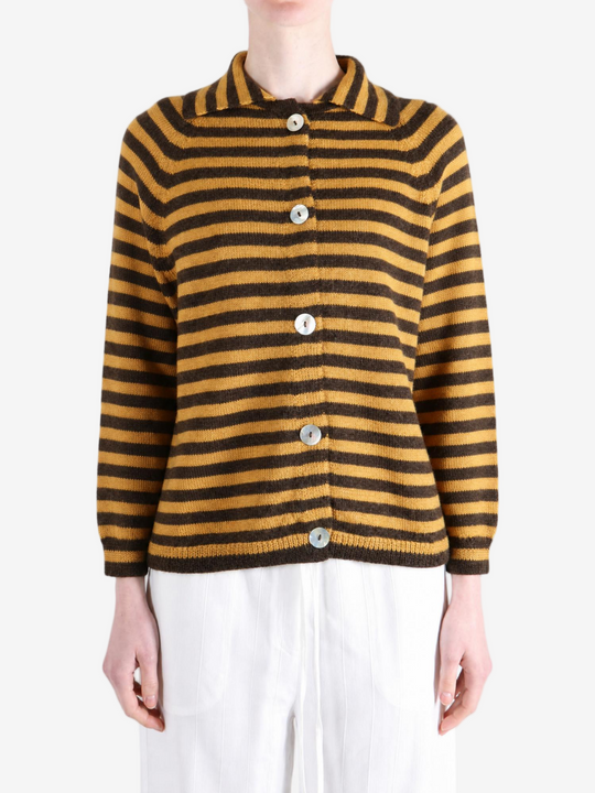 Brown knitwear worn by a person, showing the knitwear fit