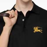 black t-shirt worn by a person, showing the t-shirt fit