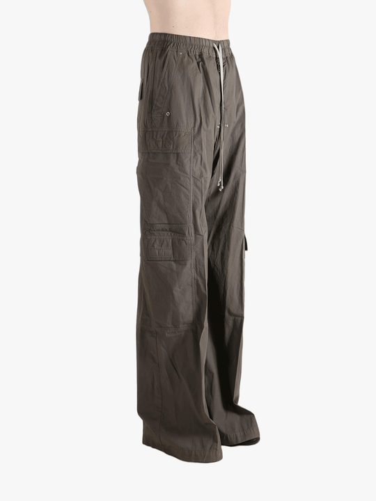 Grey pants worn by a person, showing the pants fit