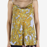 Yellow top worn by a person, showing the top's fit