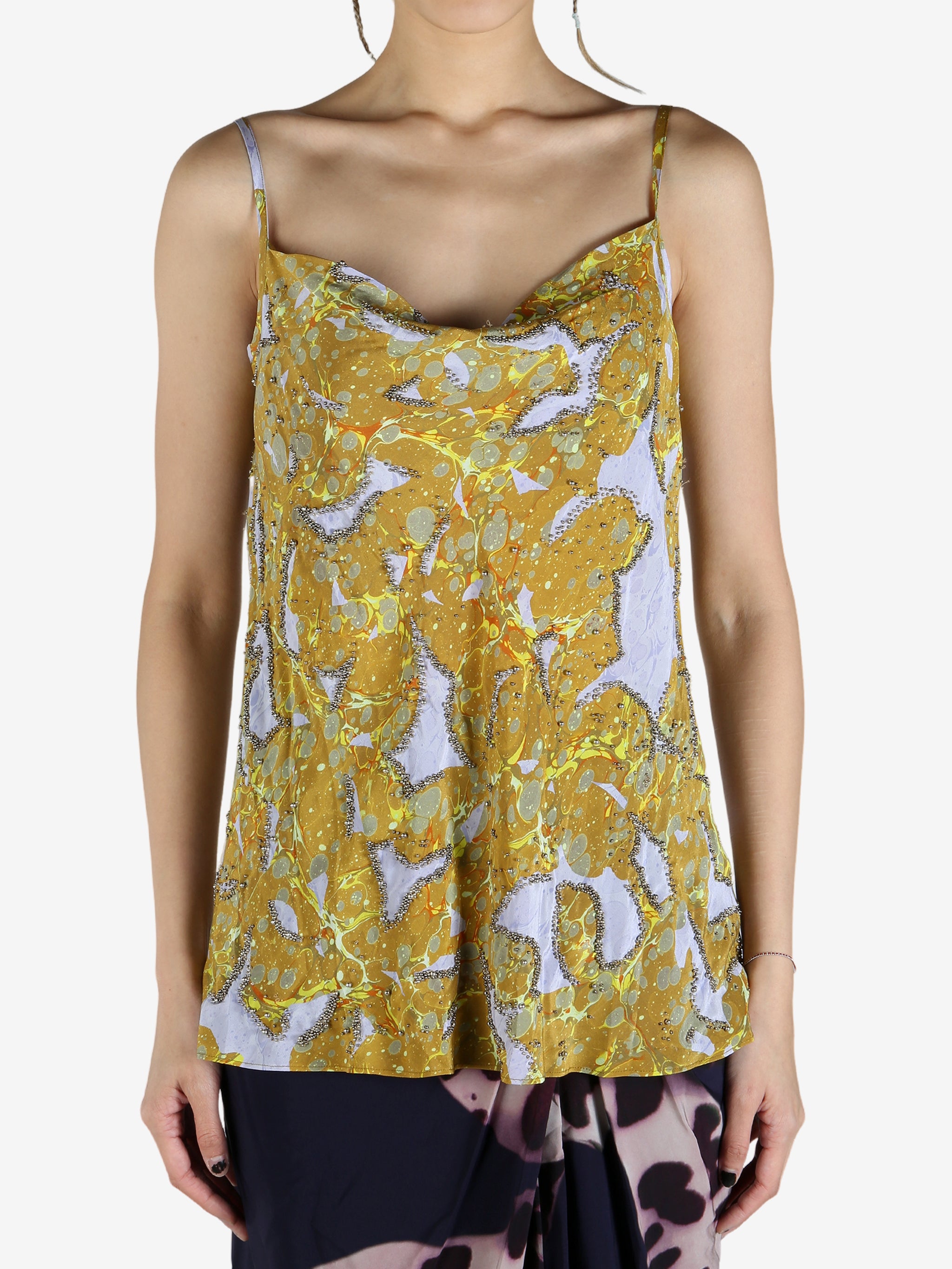 Yellow top worn by a person, showing the top's fit