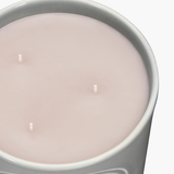 Close up of grey candles, showing texture of the fabric