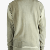 Light green cardigan worn by a person, showing the cardigan fit