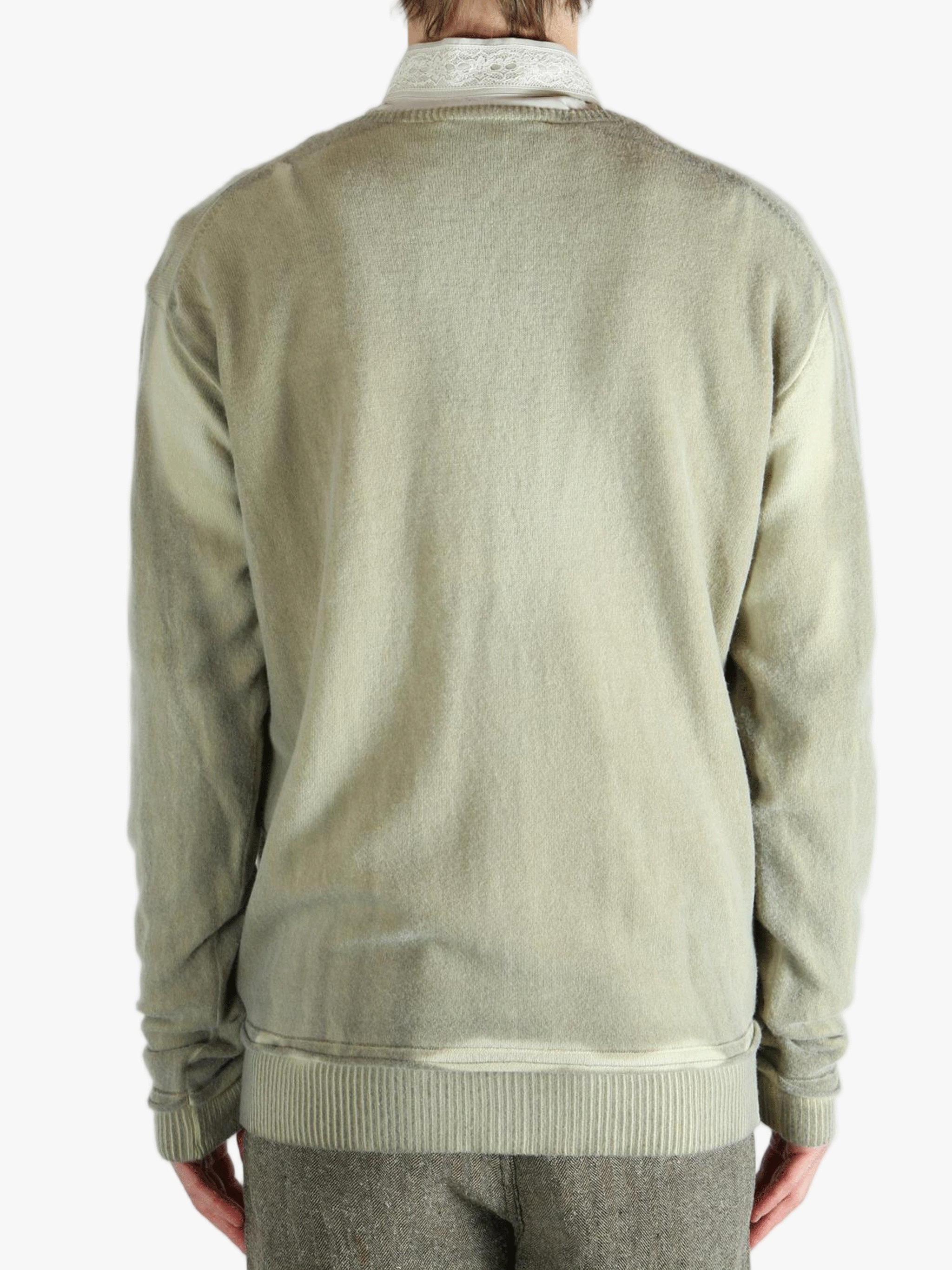 Light green cardigan worn by a person, showing the cardigan fit