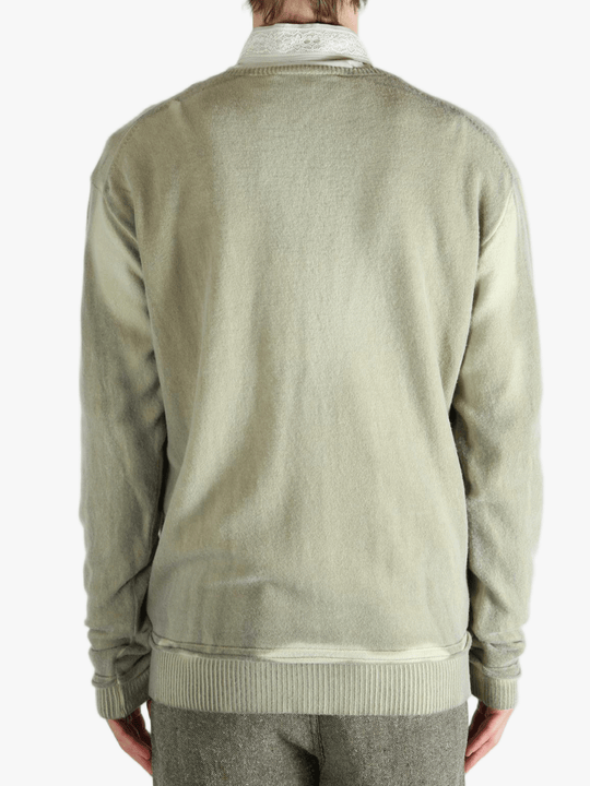 Light green cardigan worn by a person, showing the cardigan fit