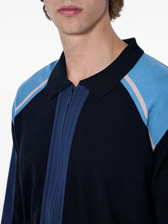 Navy knitwear worn by a person, showing the knitwear fit