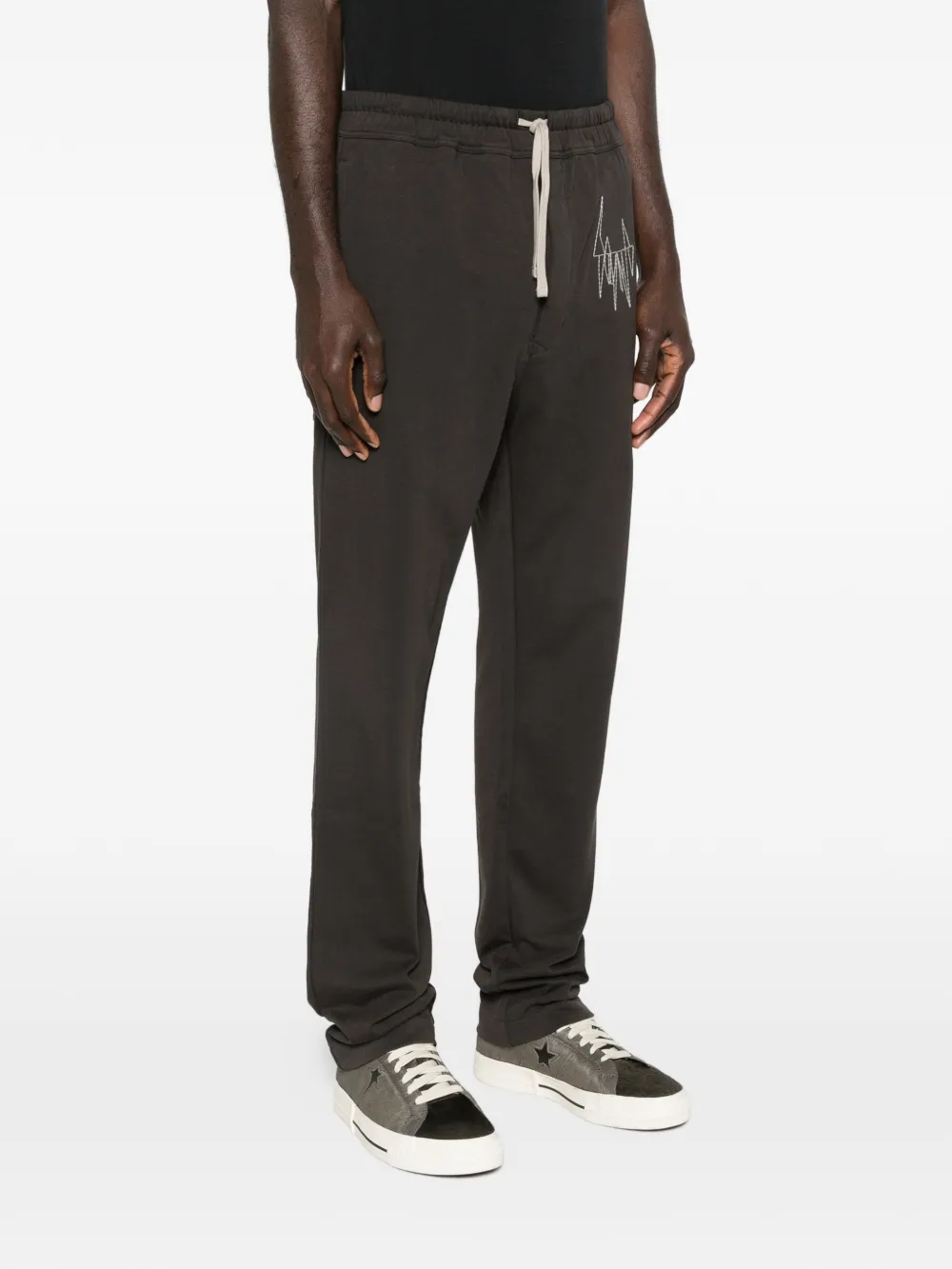 Black pant worn by a person, showing the cotton fit