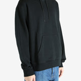Black hoodie worn by a person, showing the hoodie's fit