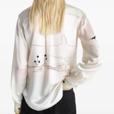 White shirts worn by a person, showing the shirts's fit