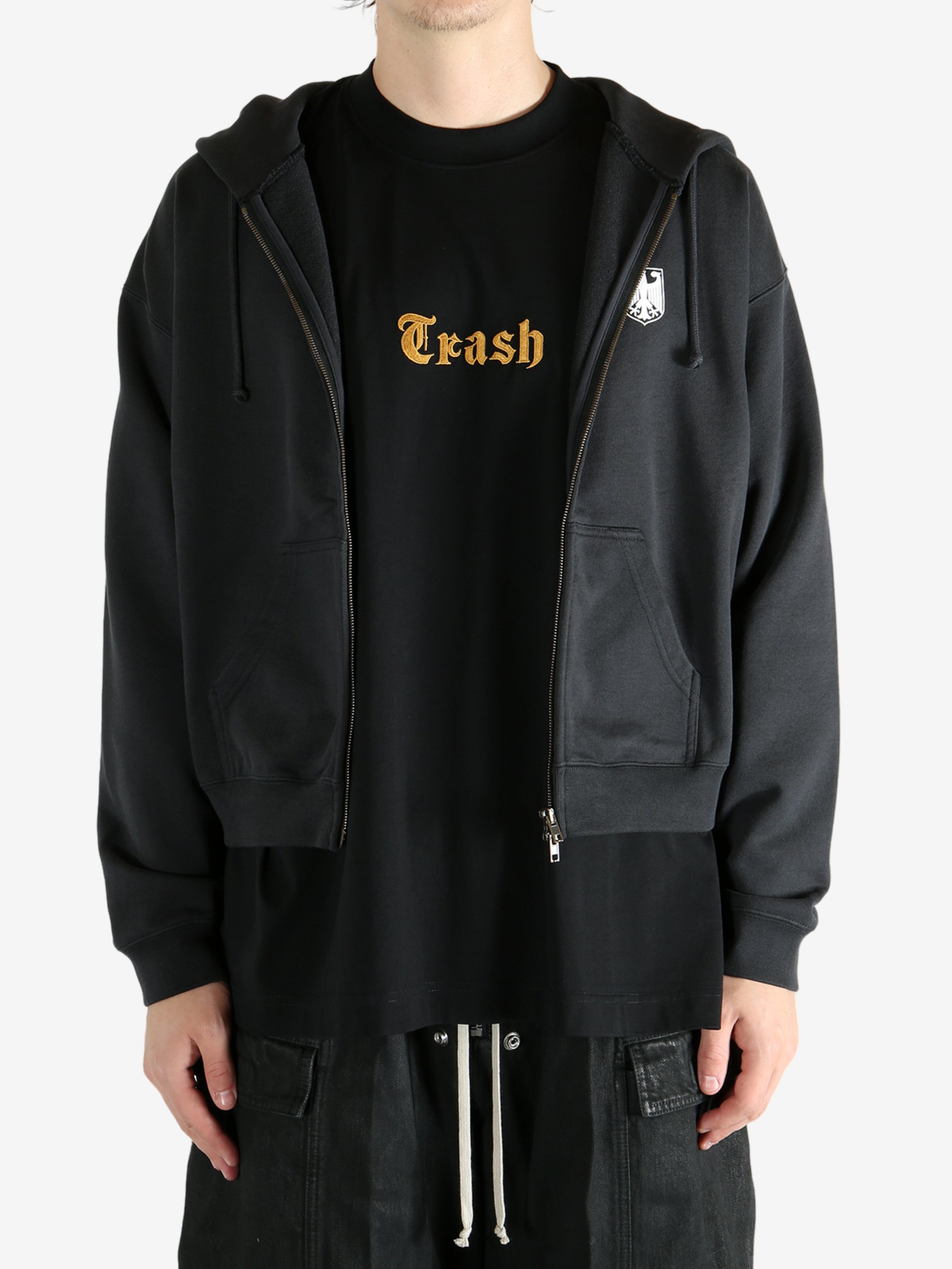 Black hoodie worn by a person, showing the hoodie's fit