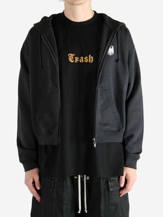 Black hoodie worn by a person, showing the hoodie's fit