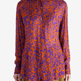 Red top worn by a person, showing the top fit