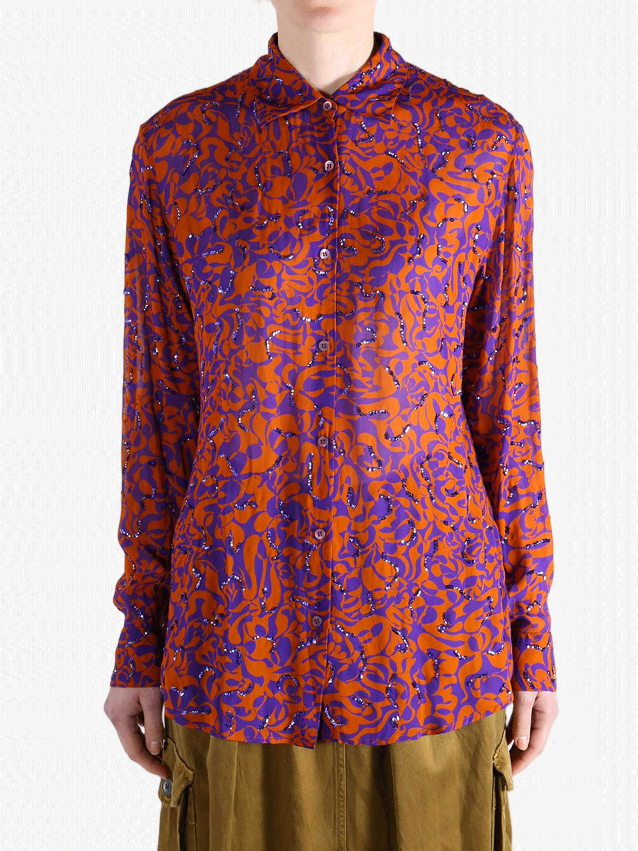 Red top worn by a person, showing the top fit