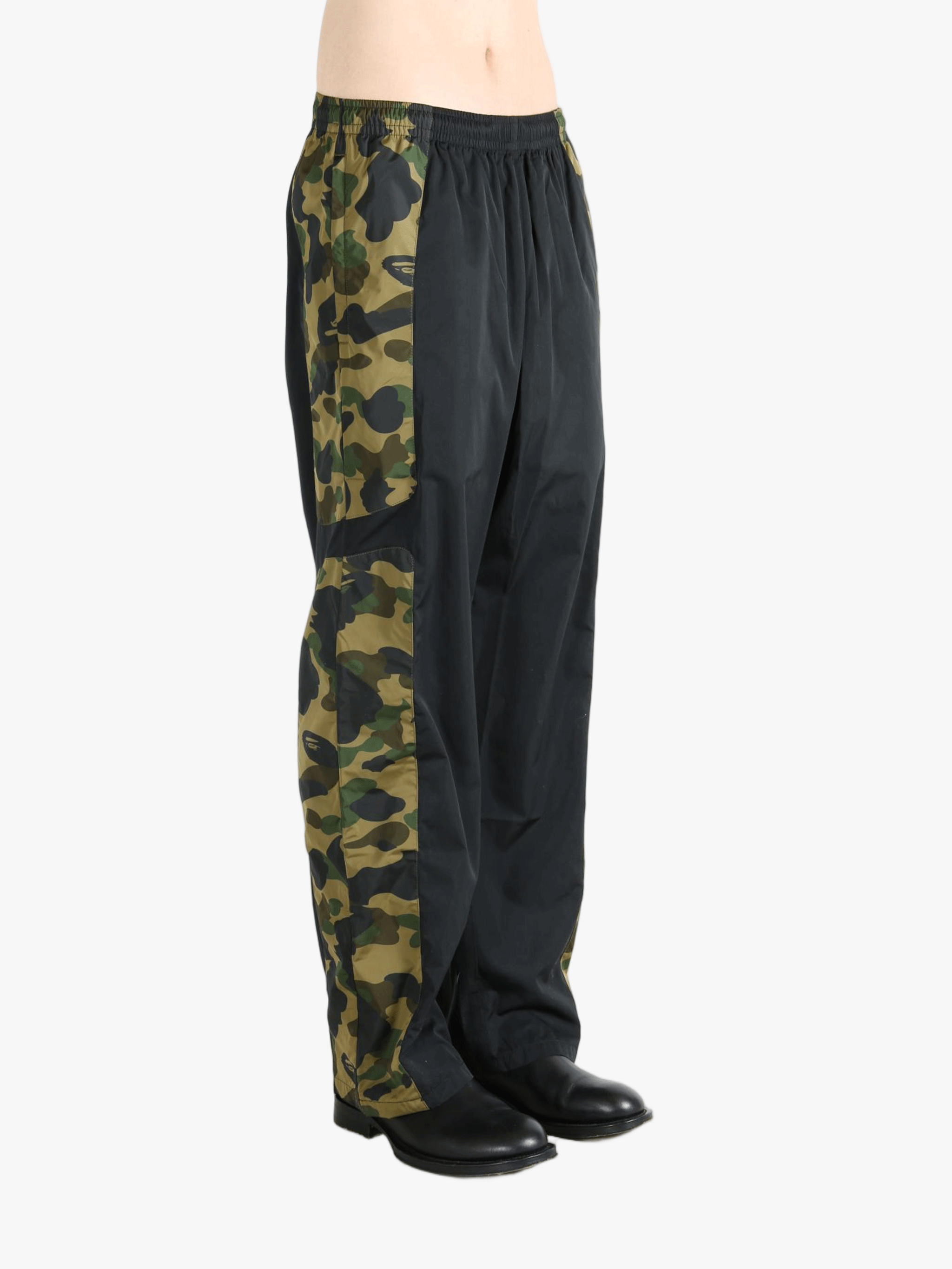 Green pants worn by a person, showing the pants fit