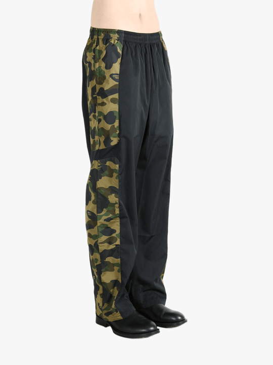 Green pants worn by a person, showing the pants fit