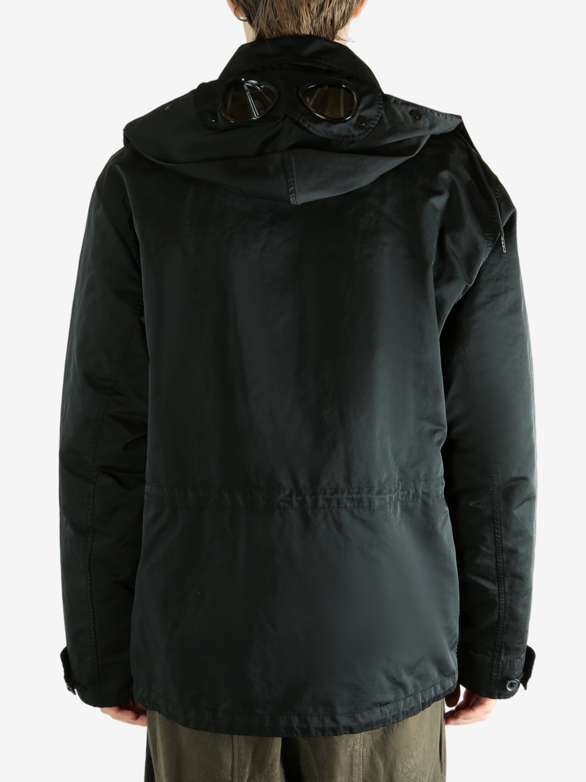 Black jacket worn by a person, showing the jacket's fit