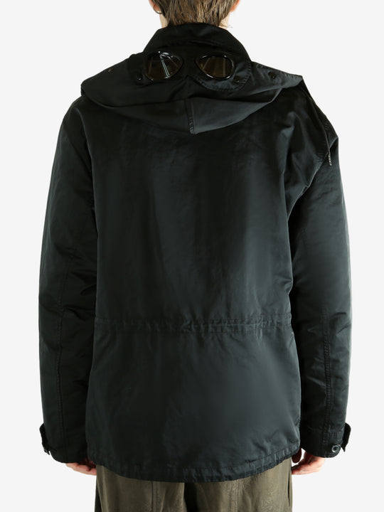 Black jacket worn by a person, showing the jacket's fit