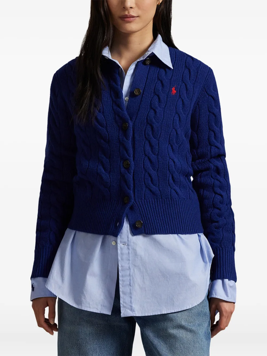 Blue sweater worn by a person, showing the sweater's fit