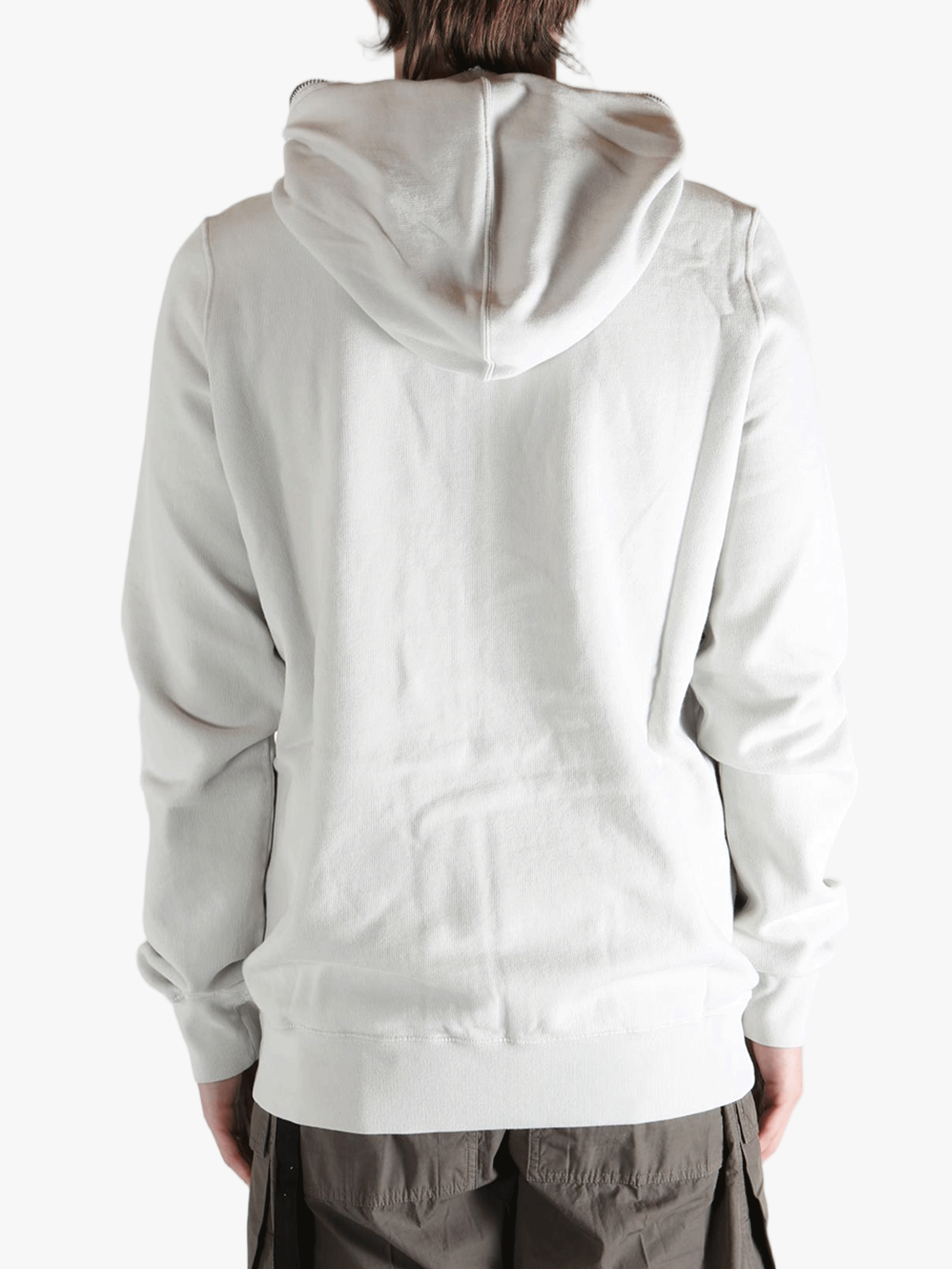 White hoodie worn by a person, showing the hoodie fit