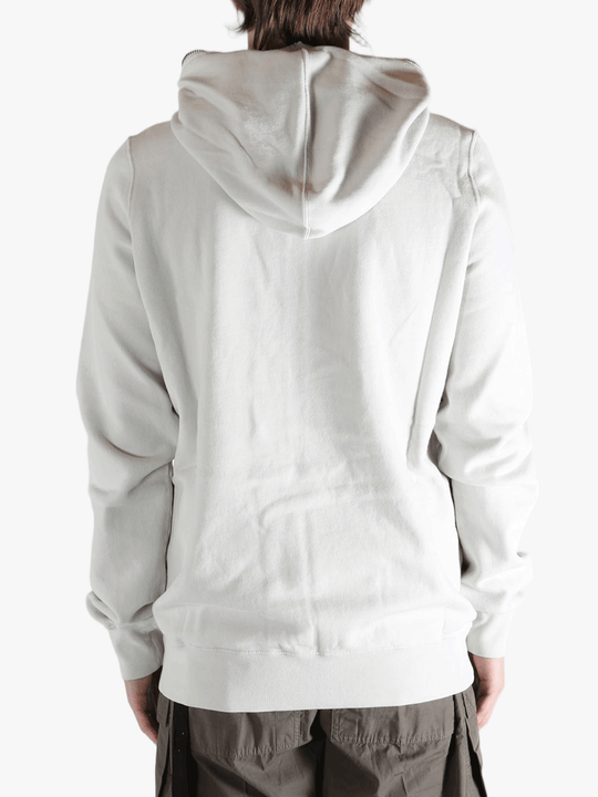 White hoodie worn by a person, showing the hoodie fit