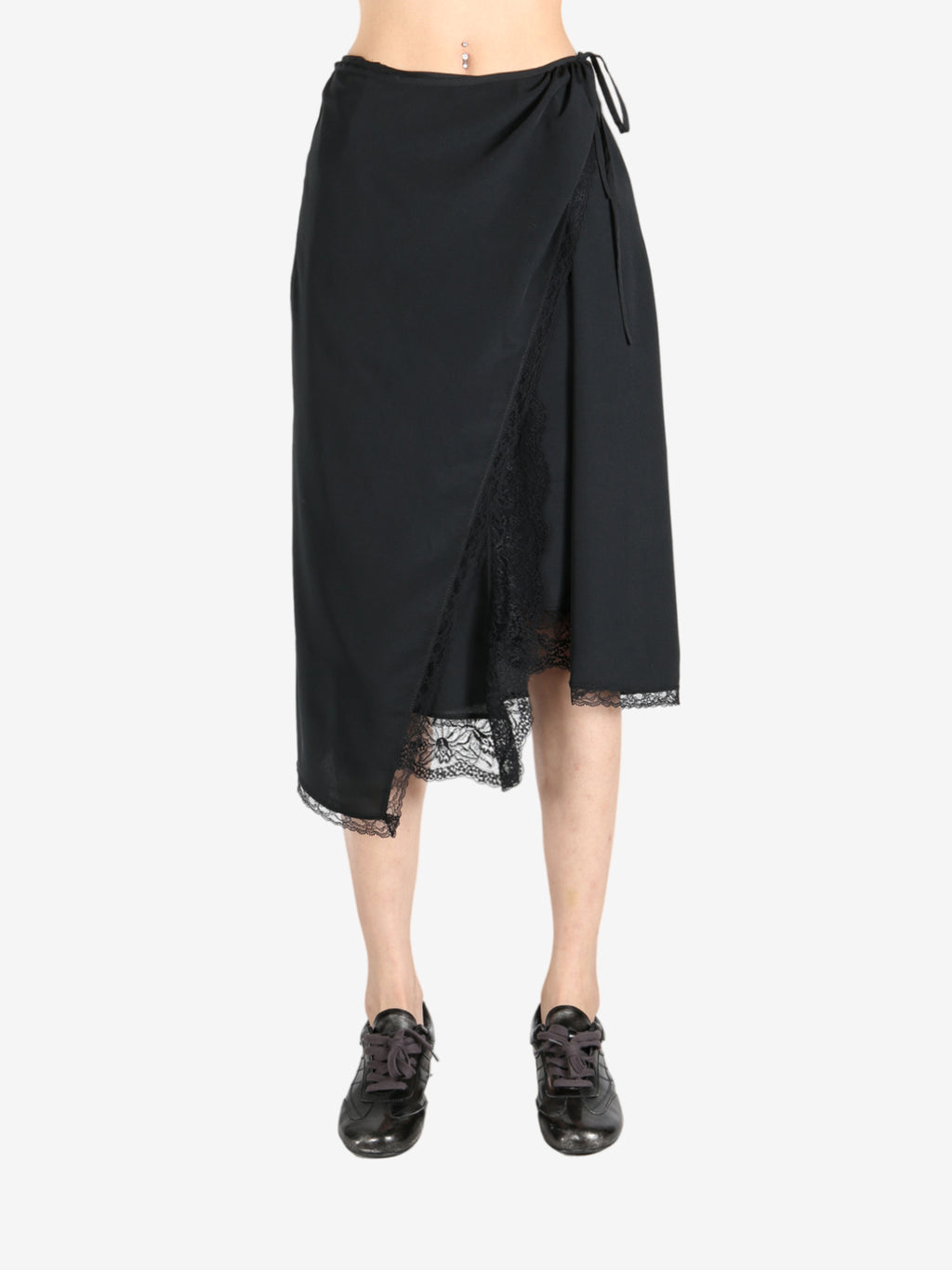 Black skirts worn by a person, showing the skirts fit