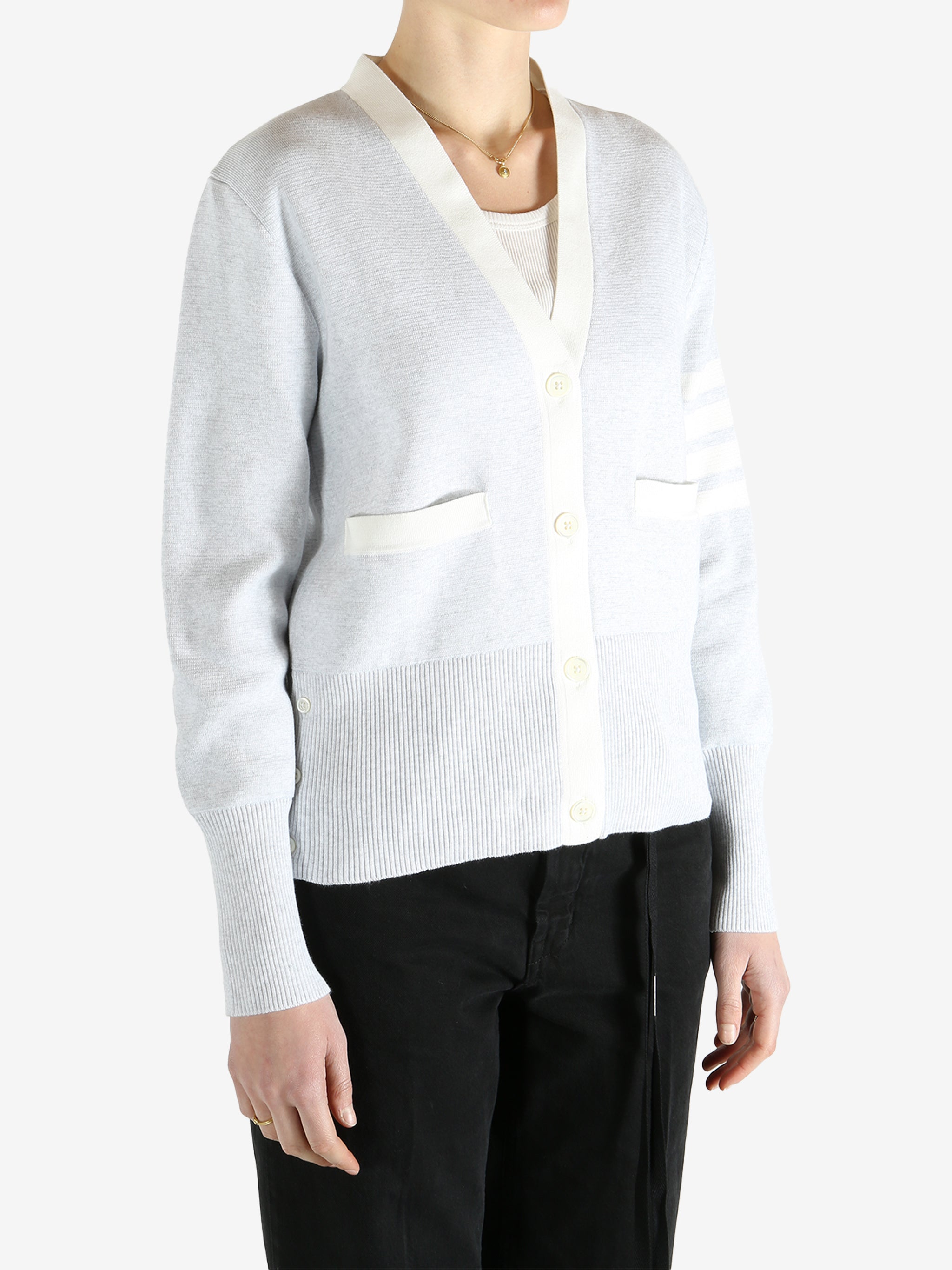 Gray cardigan worn by a person, showing the cardigan fit