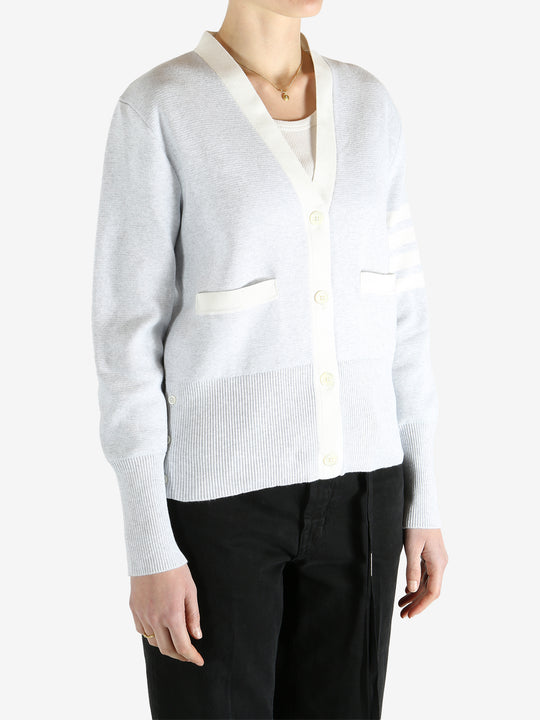 Gray cardigan worn by a person, showing the cardigan fit