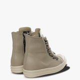 Tan sneakers, side view