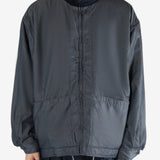 Navy jacket worn by a person, showing the jacket's fit