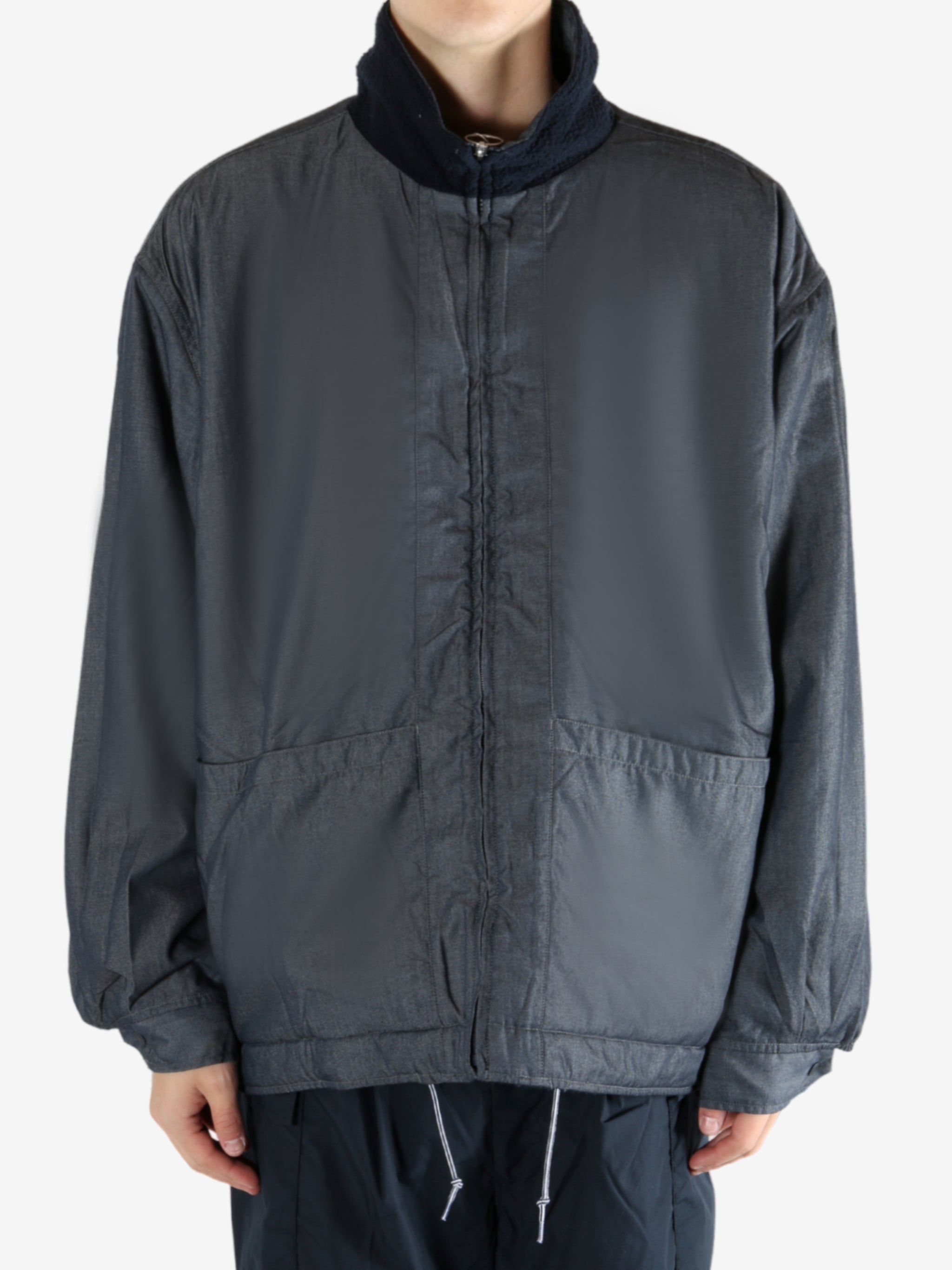 Navy jacket worn by a person, showing the jacket's fit