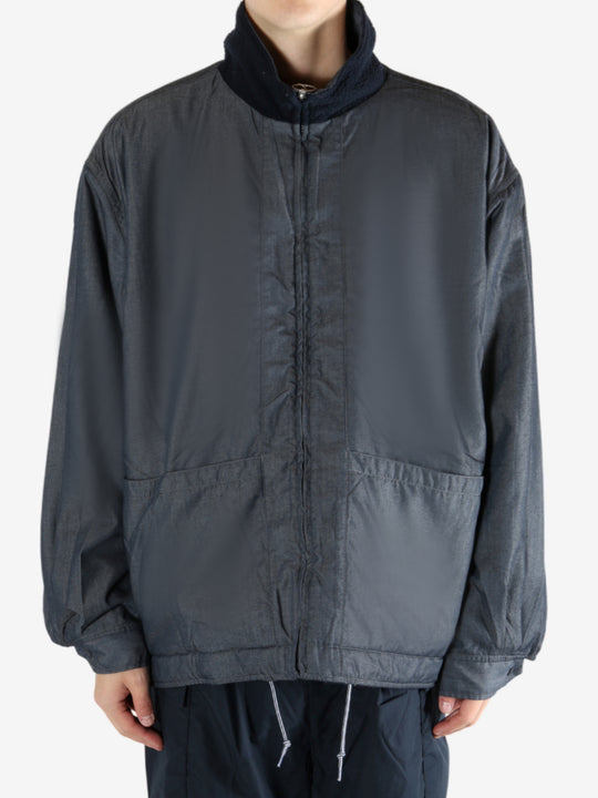 Navy jacket worn by a person, showing the jacket's fit