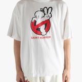 White t-shirt worn by a person, showing the shirt's fit