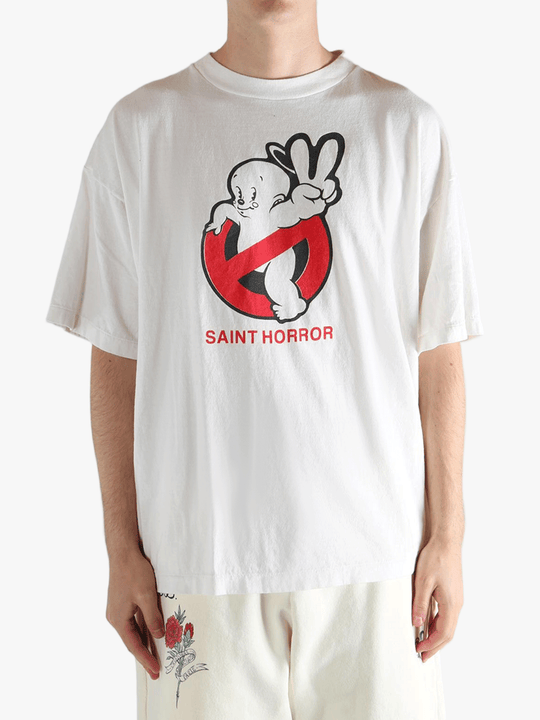 White t-shirt worn by a person, showing the shirt's fit