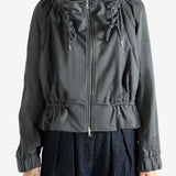 Grey jacket worn by a person, showing the jacket's fit