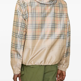 tan hoodie worn by a person, showing the  hoodie fit