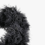 Close up of black headband, showing texture of the cotton fabric