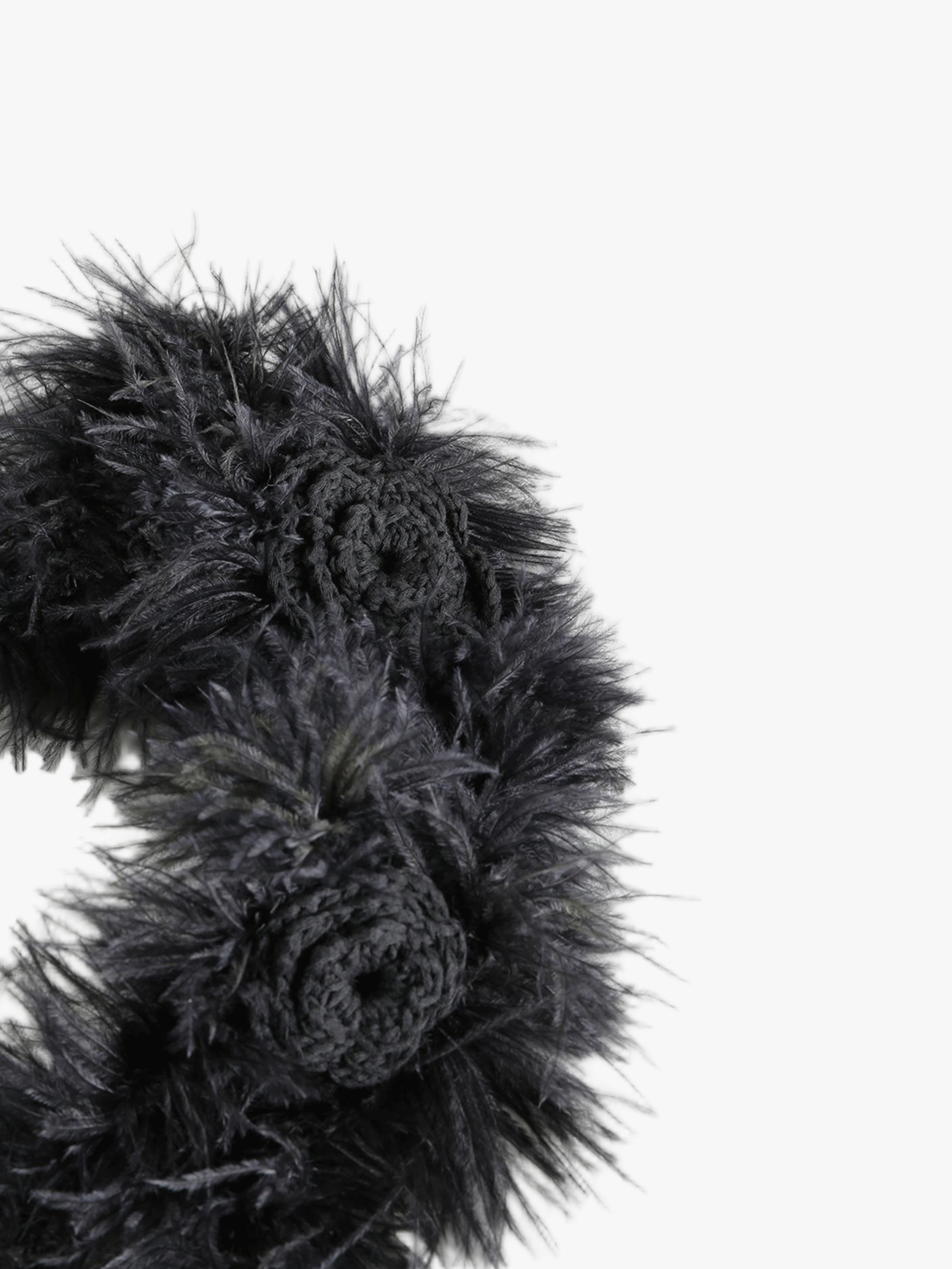 Close up of black headband, showing texture of the cotton fabric