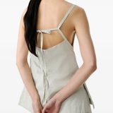Grey tops worn by a person, showing the tops's fit