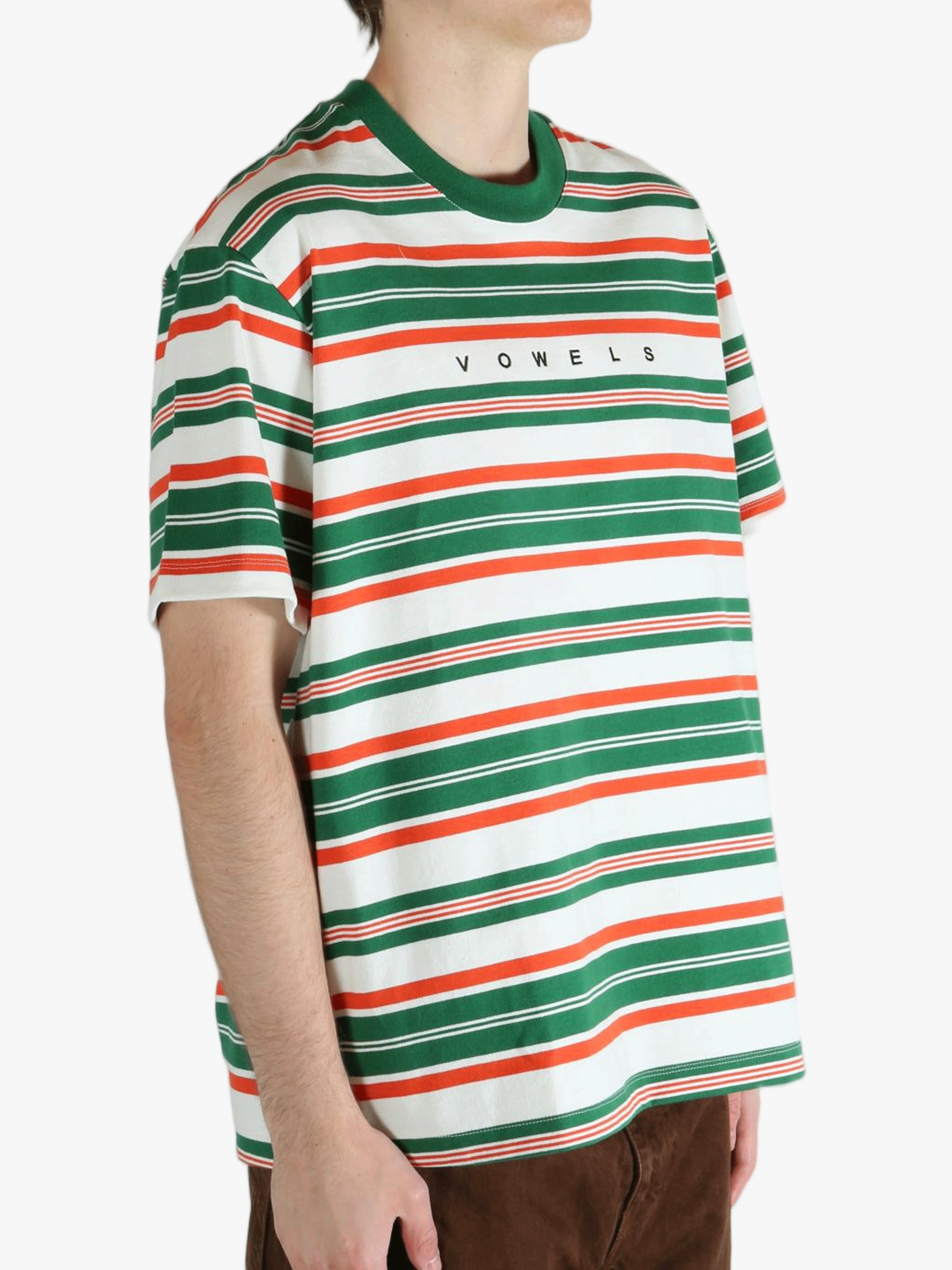 Green t-shirt worn by a person, showing the t-shirt's fit