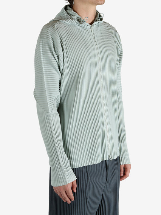 Blue jacket worn by a person, showing the jacket's fit