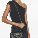 Black bag worn by a person,showing the bag fit